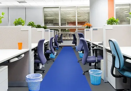 Row of purple office chairs in cubicles with a bright blue aisle runner, showcasing a clean and organized office environment after an office cleaning service.